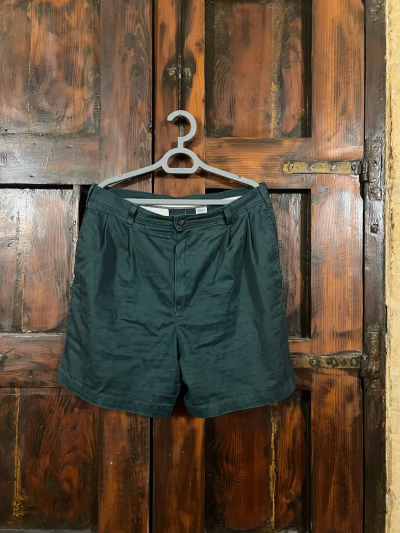 Dark green pleated tailored shorts by St. Michael Marks & Spencer — pre-loved on Thrifted.mt