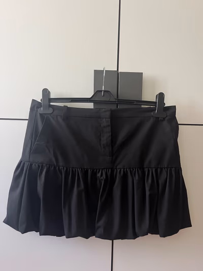 Black bubble Mango mini skirt by Mango — pre-loved on Thrifted.mt