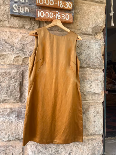 DKNY Sleeveless Shimmering Gold Mini Dress by DKNY — pre-loved on Thrifted.mt