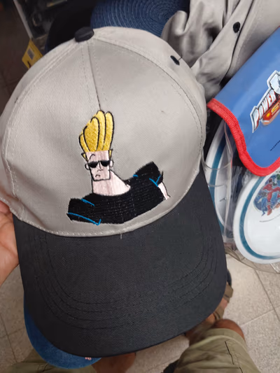 Vintage 2001 Johnny Bravo Cartoon Cap Marini Silvano by Johnny Bravo — pre-loved on Thrifted.mt