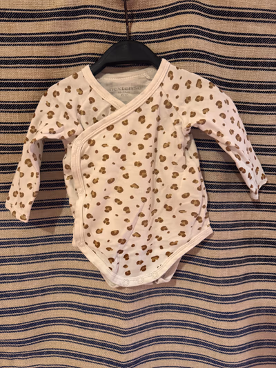 Baby leopard print bodysuit by Nextenso — pre-loved on Thrifted.mt