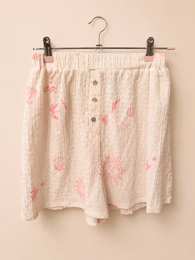 Pantalones cortos de playa estampados en color crema by Kiabi — pre-loved on Thrifted.mt