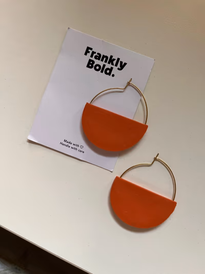 Frankly Bold orange hoop earrings by Frankly Bold — pre-loved on Thrifted.mt