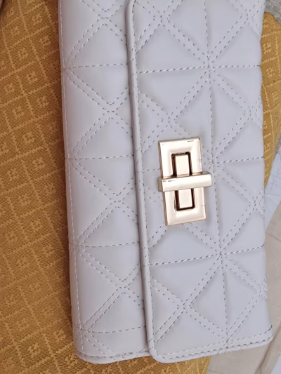 Quilted Faux Leather Twist Lock Wallet by Primark — pre-loved on Thrifted.mt