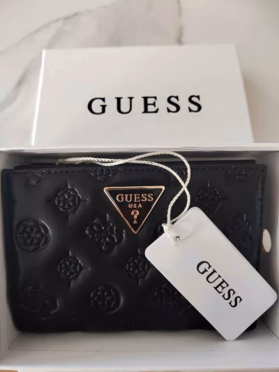 Guess Logo Embossed Wallet by GUESS — pre-loved on Thrifted.mt
