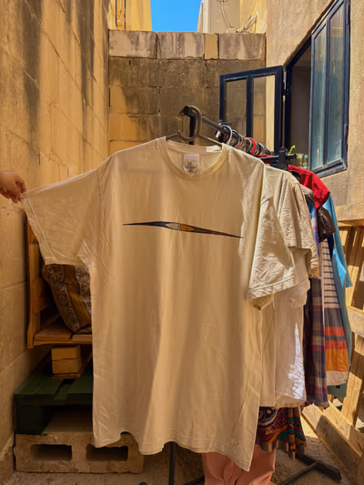 Cream Nike Graphic T-Shirt by Nike — pre-loved on Thrifted.mt