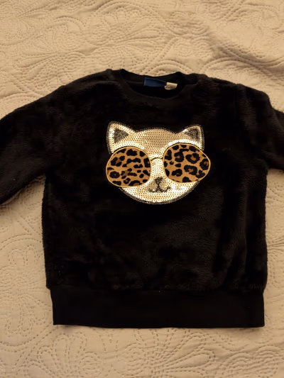 Black fluffy cat sequin jumper by Chicco — pre-loved on Thrifted.mt