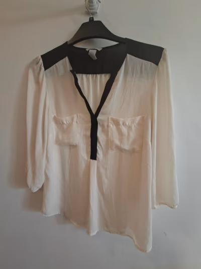 Cream and black contrast blouse by H&M — pre-loved on Thrifted.mt