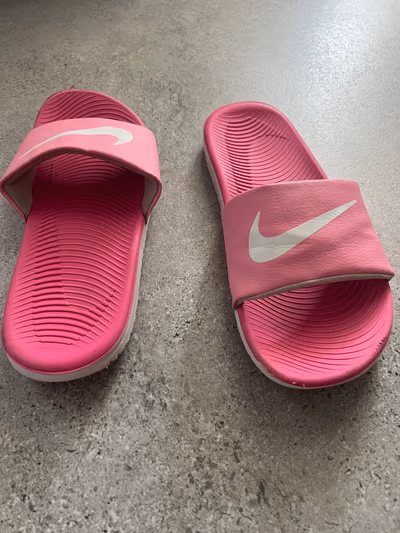Nike Pink Logo Slides by Nike — pre-loved on Thrifted.mt