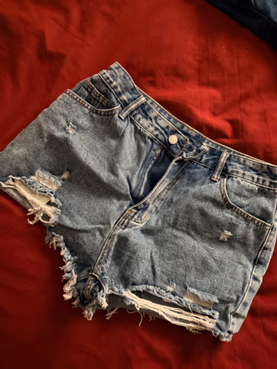 Distressed blue denim shorts — pre-loved on Thrifted.mt