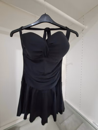 Black ruched skirt swimsuit — pre-loved on Thrifted.mt