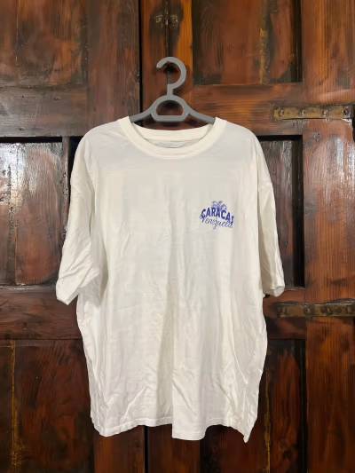 White Caracas Venezuela Graphic T-Shirt by Kiabi — pre-loved on Thrifted.mt