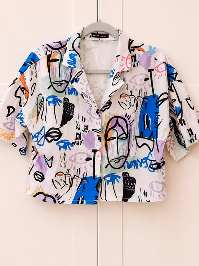 Abstract graffiti print button-up shirt by Shein — pre-loved on Thrifted.mt