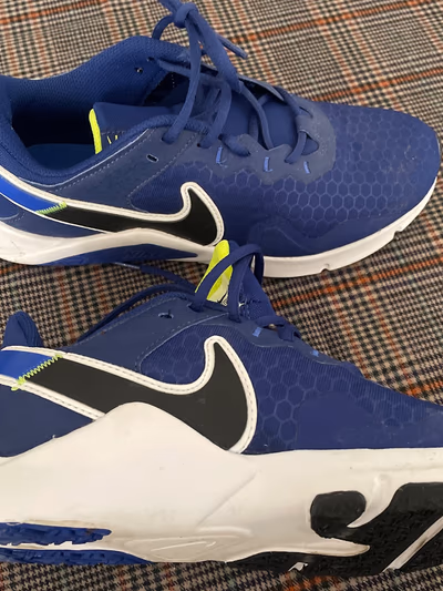 Blue Nike Trainers by Nike — pre-loved on Thrifted.mt