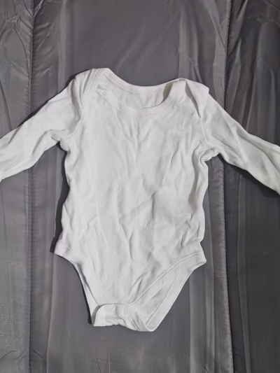 Plain white baby bodysuit — pre-loved on Thrifted.mt
