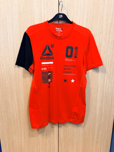 Reebok Graphic Sports Tee by Reebok — pre-loved on Thrifted.mt