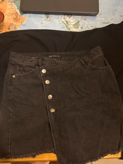 Black asymmetrical button denim skirt by LC Waikiki — pre-loved on Thrifted.mt