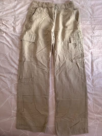 Light green H&M natural fabric blend pants by H&M — pre-loved on Thrifted.mt