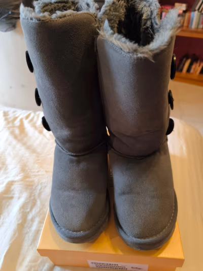 Grey UGG Bailey Button Boots by UGG — pre-loved on Thrifted.mt