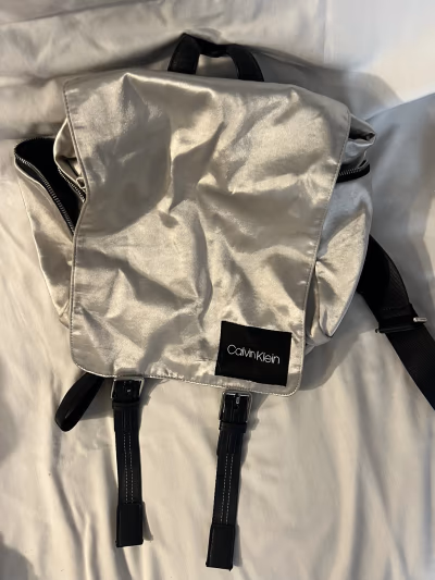 Calvin Klein metallic silver backpack — pre-loved on Thrifted.mt