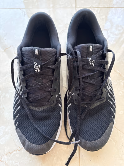 Nike Run Defy Running Trainers by Nike — pre-loved on Thrifted.mt