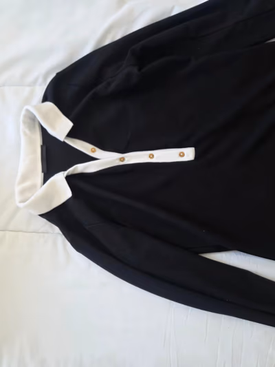 Polo bianca e nera by Zara — pre-loved on Thrifted.mt