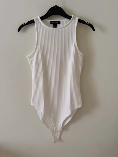 White Ribbed Sleeveless Bodysuit by New Look — pre-loved on Thrifted.mt