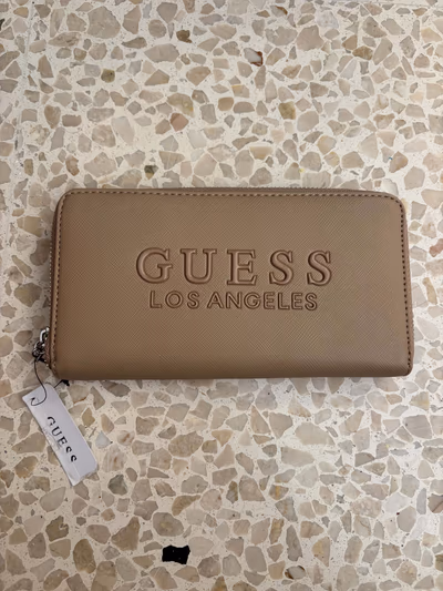 Guess Los Angeles Beige Wallet by Guess — pre-loved on Thrifted.mt