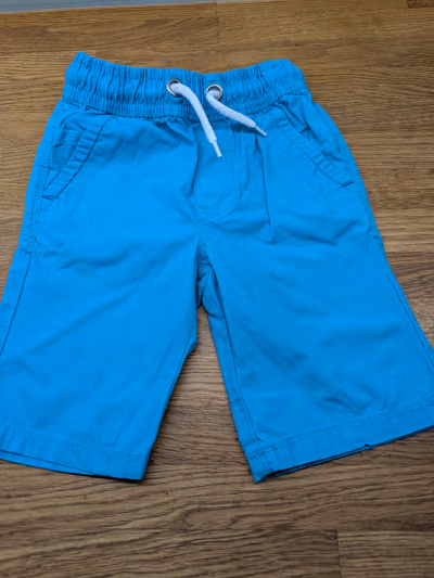 Bright blue boys shorts by Next — pre-loved on Thrifted.mt