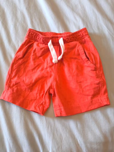Red cotton baby shorts by Sfera — pre-loved on Thrifted.mt
