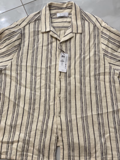 Striped textured button-down shirt by Primark — pre-loved on Thrifted.mt