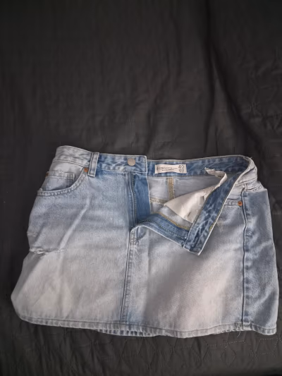 Light wash denim mini skirt by Stradivarius — pre-loved on Thrifted.mt