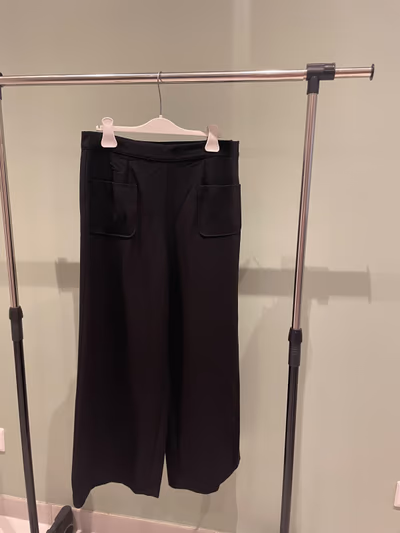 Black wide-leg tailored trousers by Promod — pre-loved on Thrifted.mt