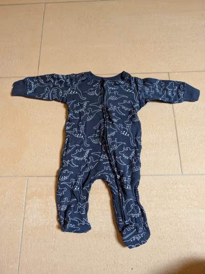Baby dinosaur print sleepsuit by Matalan — pre-loved on Thrifted.mt