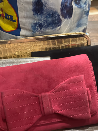 Collection of assorted clutch bags — pre-loved on Thrifted.mt