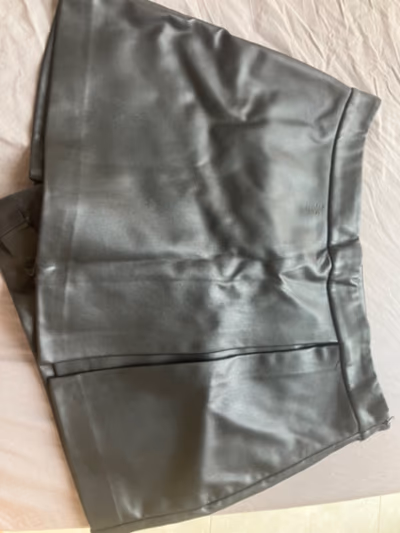 Black faux leather mini skirt/shorts by Don't Call Me Jennyfer — pre-loved on Thrifted.mt