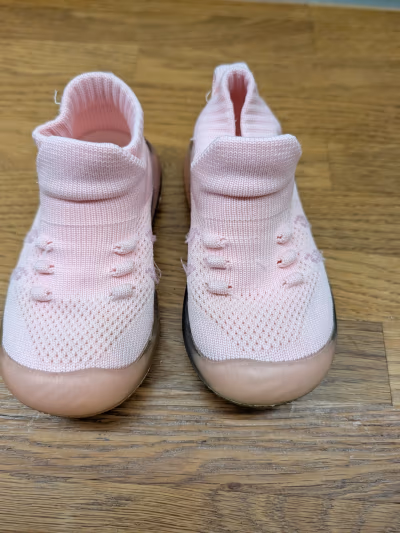 Girls light pink knitted trainers with rainbow soles by Nelli Blu — pre-loved on Thrifted.mt