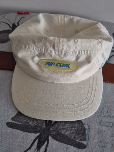 Cream Rip Curl baseball cap by Rip Curl — pre-loved on Thrifted.mt