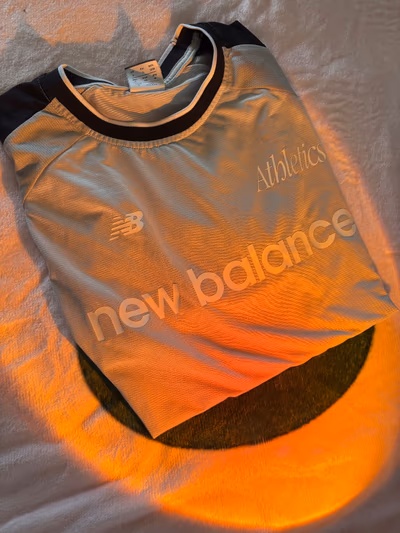 New Balance Athletics T-shirt by New Balance — pre-loved on Thrifted.mt