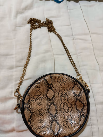 Borsa a tracolla rotonda con stampa serpente — pre-loved on Thrifted.mt