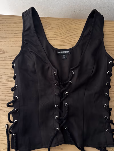 Black lace-up sleeveless top by PrettyLittleThing — pre-loved on Thrifted.mt