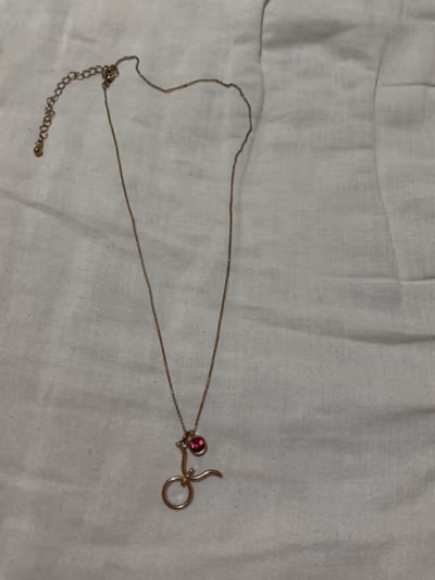 Taurus Gold Tone Pink Stone Necklace — pre-loved on Thrifted.mt
