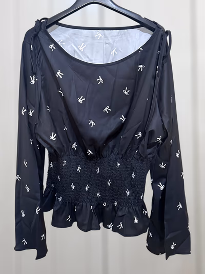 Shein Curve Brand New Black long-sleeve blouse with white bow print and scoop neckline with ties by Shein  — pre-loved on Thrifted.mt