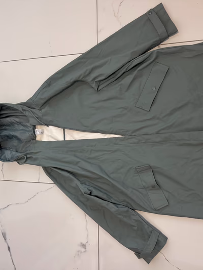 Green hooded raincoat jacket by anko — pre-loved on Thrifted.mt