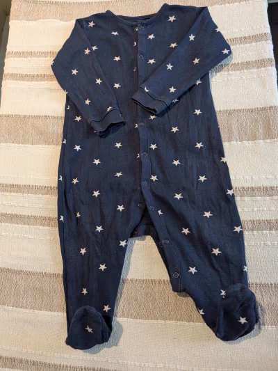 Next navy star print sleepsuit by Next — pre-loved on Thrifted.mt