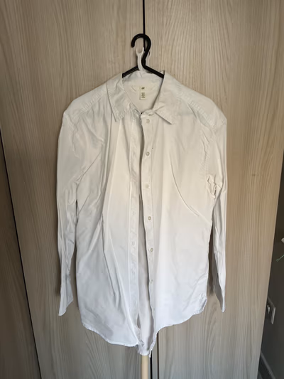 Classic white button-up shirt by H&M — pre-loved on Thrifted.mt