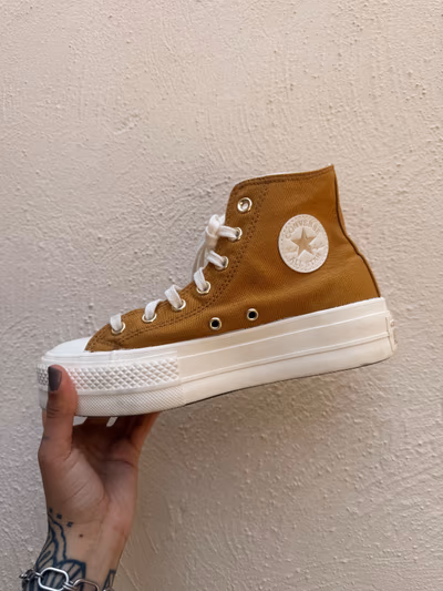 Converse Chuck Taylor All Star Lift Hi Platform Trainers in Gold by Converse — pre-loved on Thrifted.mt
