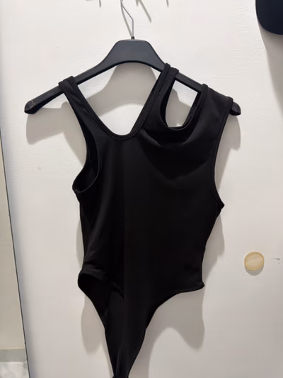 Black asymmetrical cut-out bodysuit by SHEIN — pre-loved on Thrifted.mt